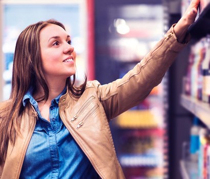 Customer reaching for product